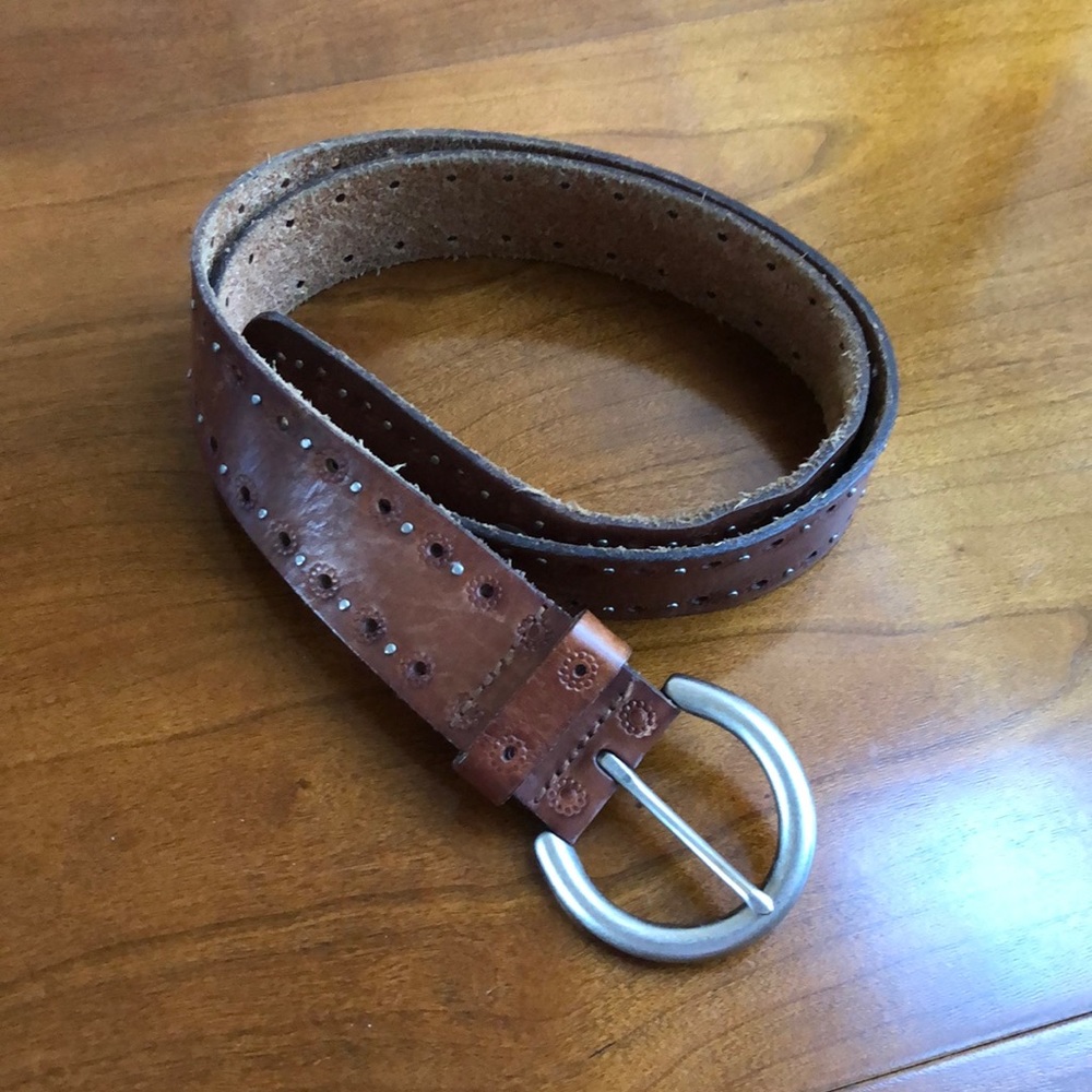 Belt in stamped/studded leather.